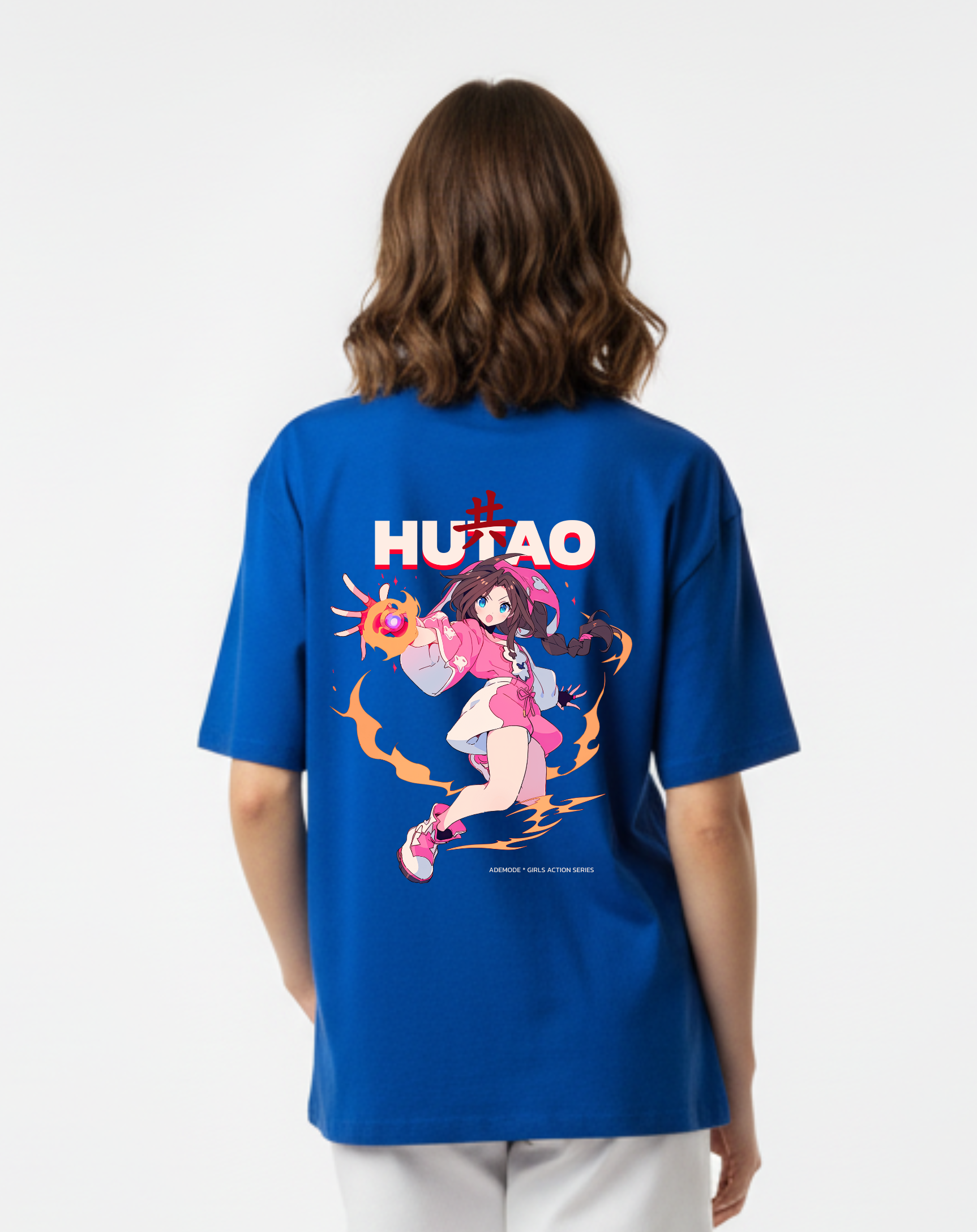 Person wearing a blue t-shirt with a graphic design on the back, standing against a white background